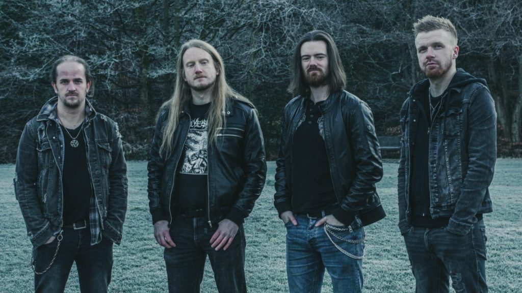 “Blackfyre Rising band standing in a frosty Scottish field, dressed in black denim and leather — Scottish hard rock band with a classic rock aesthetic”