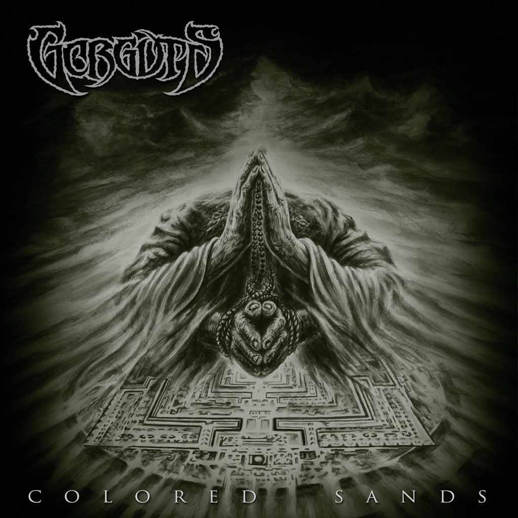 Gorguts Colored Sands album cover featuring a detailed monochromatic illustration of a robed figure with hands in prayer, surrounded by swirling sand and a labyrinth design.