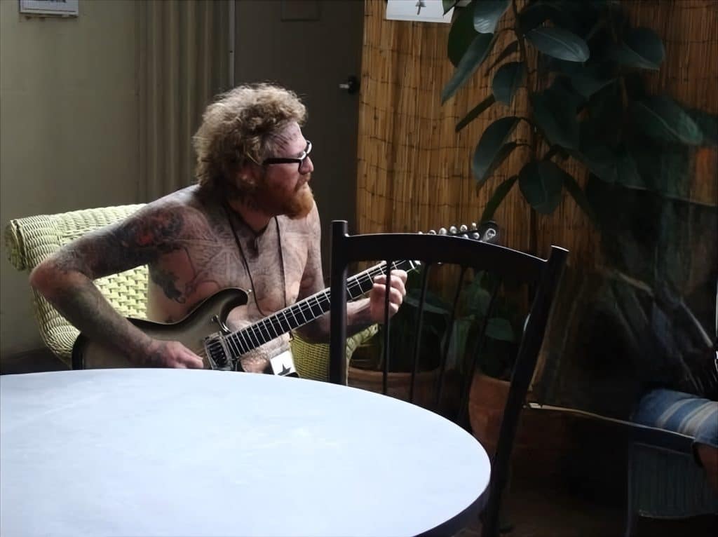 “Brent Hinds of Mastodon playing guitar shirtless in the VIP lounge at Mayhem Fest 2008 in Tampa, Florida. Photo by Metal Lair. Brent Hinds dead at 51 tribute.”
