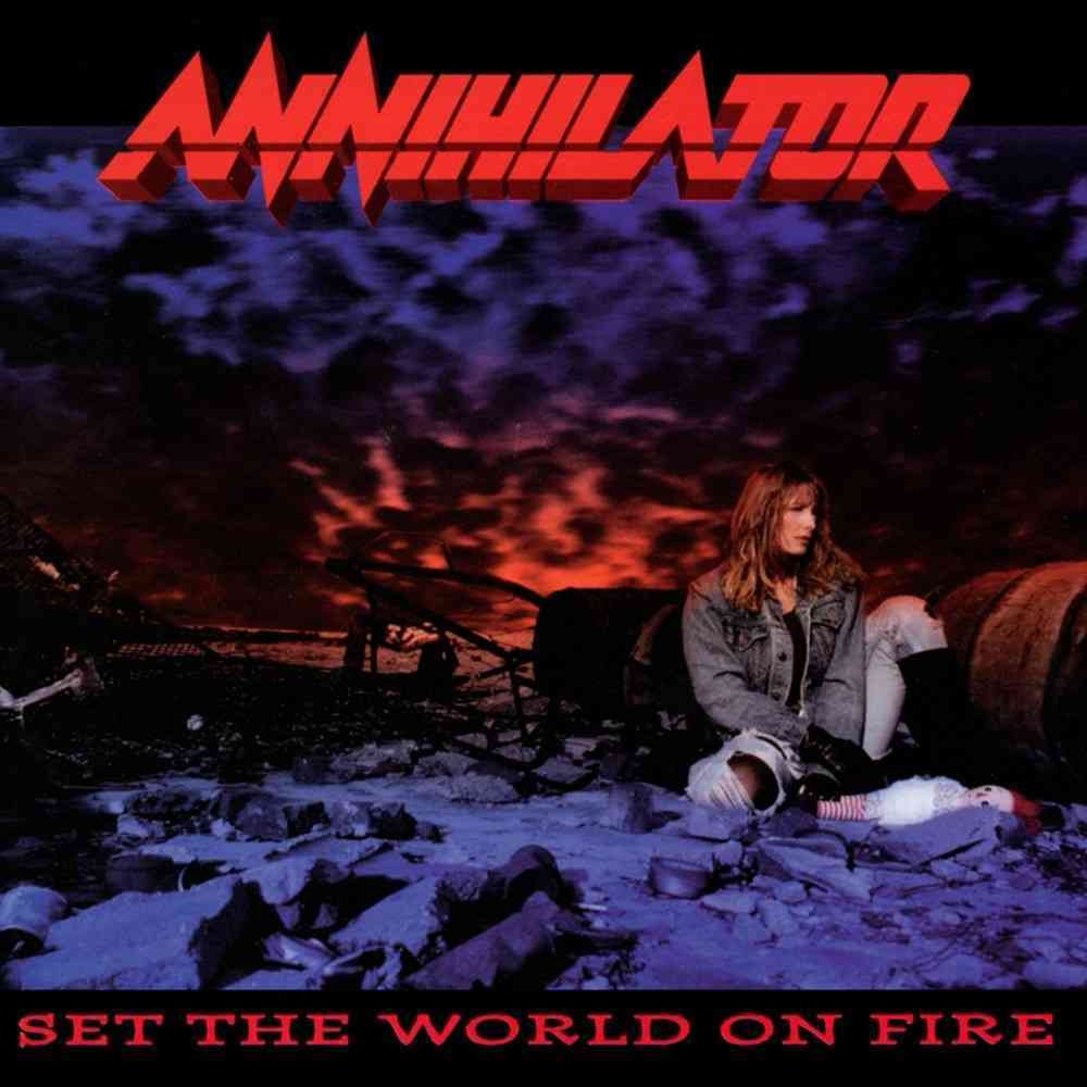Annihilator’s Set the World on Fire album cover featuring a figure sitting in ruins against a burning sky.