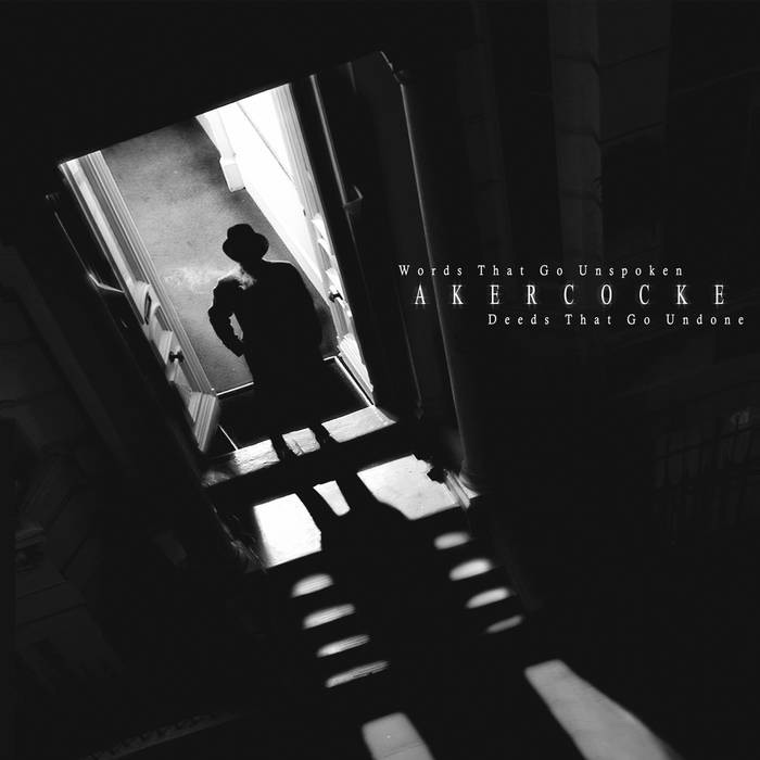 Akercocke – Words That Go Unspoken, Deeds That Go Undone album cover featuring a silhouetted figure in a doorway with shadows on the stairs