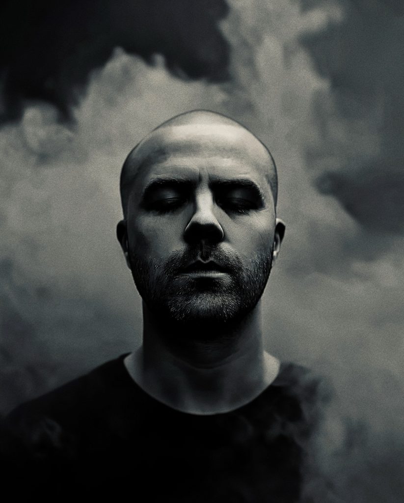 Composer Andrew Gordon Macpherson portrait with smoke backdrop – Into the Void Hulu documentary score