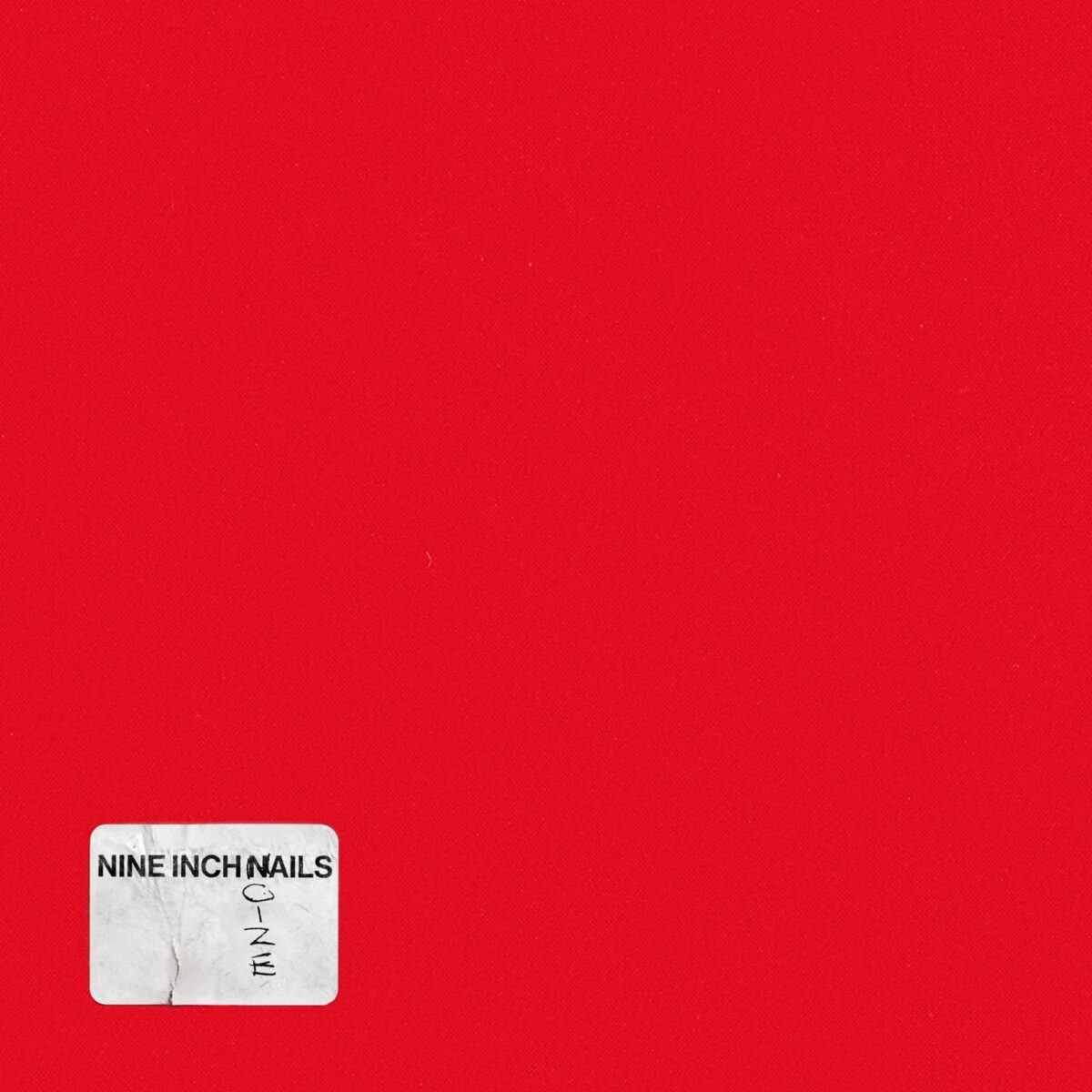 Nine Inch Nails Nine Inch Noize album artwork featuring a stark white logo block against a bright red minimalist background.