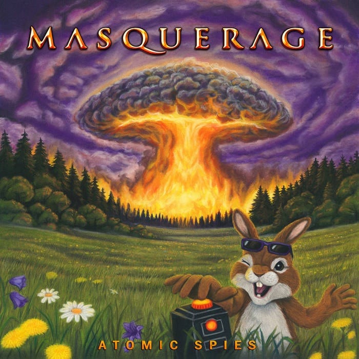 Masquerage Atomic Spies album cover showing a cartoon rabbit triggering a detonator while a mushroom cloud rises behind a forest.