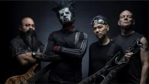 Static-X promotional band photo featuring Xer0 and the band standing in dark industrial lighting during the 2026 touring era.