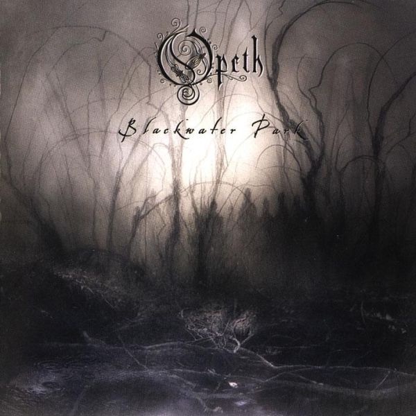 Opeth Blackwater Park album cover showing a dark, misty forest with barren trees fading into the distance.