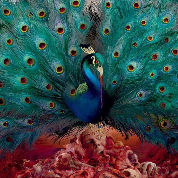 Opeth Sorceress album cover featuring a colorful peacock standing atop a mound of skulls and bones.