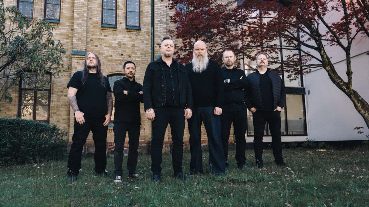 Green Carnation band members pose outside a historic church before the release of A Dark Poem, Part III: The Messiah Complex in 2026.