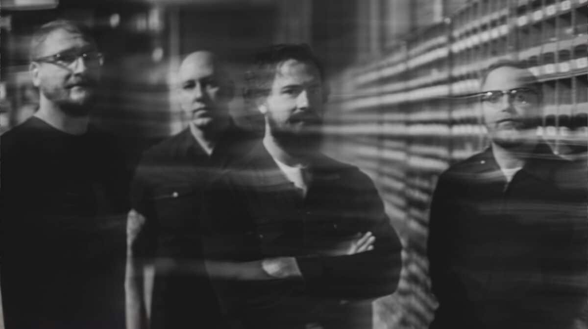 Wailin’ Storms promotional band photo featuring the four members in a black-and-white portrait.