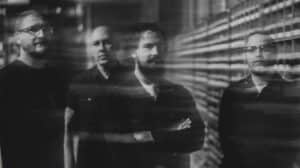 Wailin’ Storms promotional band photo featuring the four members in a black-and-white portrait.
