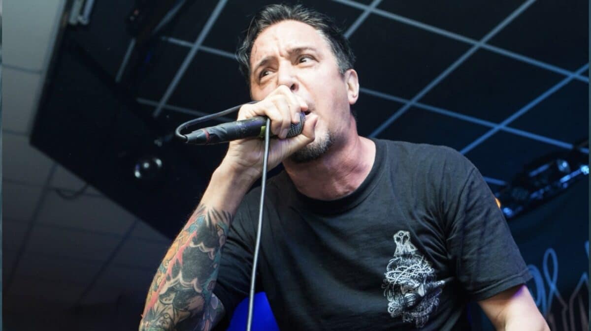 Remembering Lou Koller as the Sick Of It All frontman performs live on stage during a hardcore punk concert.
