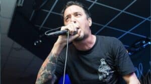 Remembering Lou Koller as the Sick Of It All frontman performs live on stage during a hardcore punk concert.