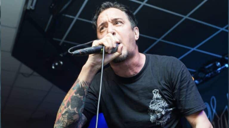 Remembering Lou Koller as the Sick Of It All frontman performs live on stage during a hardcore punk concert.