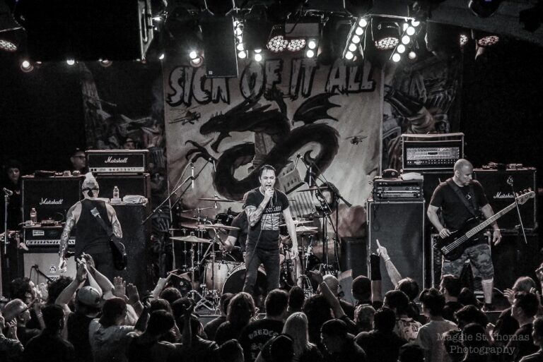 Remembering Lou Koller performing live with Sick Of It All during a high-energy hardcore punk concert.