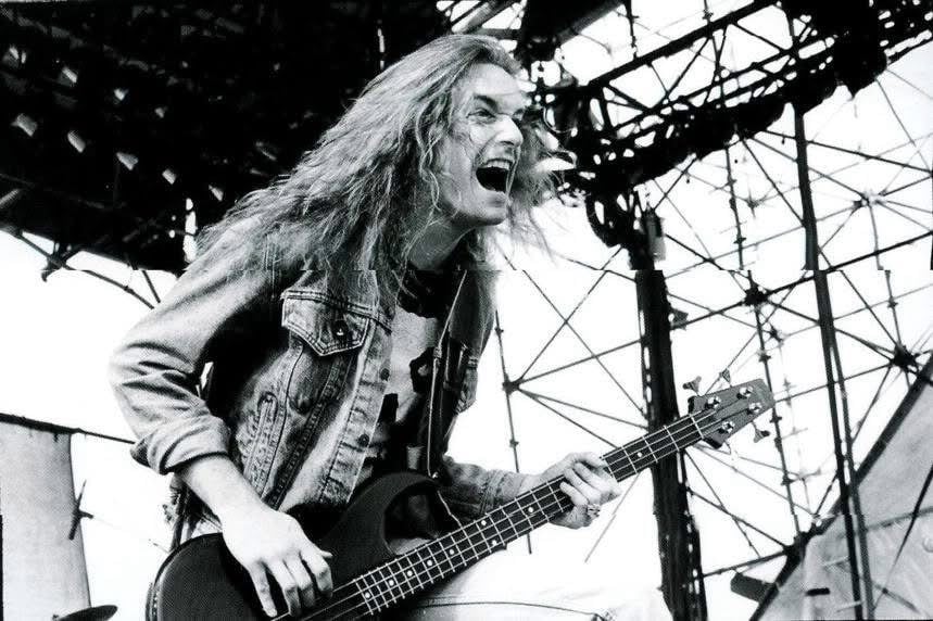 Metal Legacy Profiles: Cliff Burton performing on bass alongside James Hetfield during a live Metallica performance.