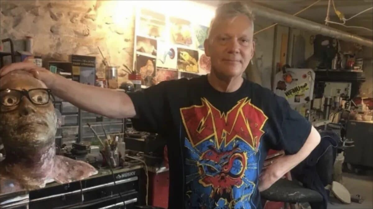 Chuck Varga GWAR artist and co-founder pictured in his workshop surrounded by sculpture and production materials.