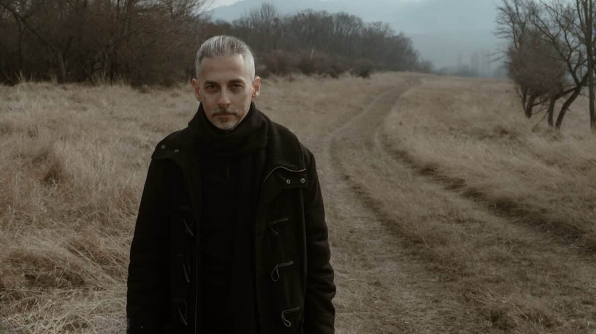 Thy Catafalque Tamás Kátai interview featuring the Hungarian musician standing in an autumn landscape