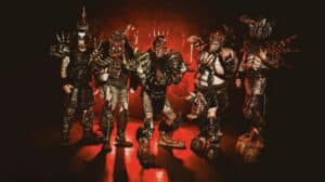 GWAR Joe Bob Briggs New Album – GWAR band members in elaborate monster costumes against a dramatic red background.