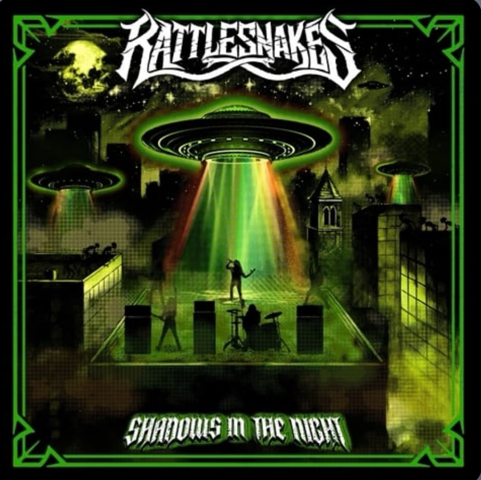 Rattlesnakes Shadows in The Night album cover featuring green UFOs projecting beams of light over a rooftop band performance.
