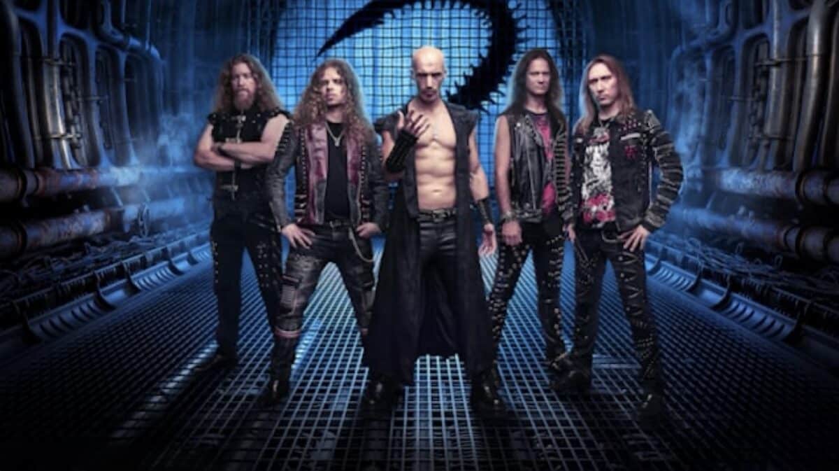 Beast in Black 2027 North American tour featured band photo showing five members standing in a blue-lit futuristic industrial corridor.
